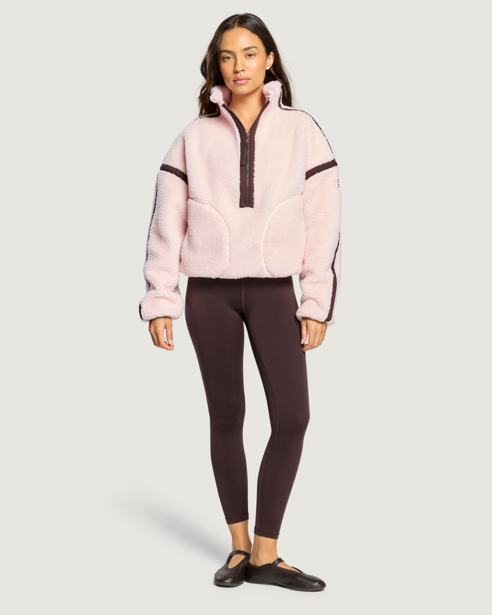 Model wearing Gym+Coffee Industry Fleece Half Zip Ballet Pink Shop Gym+Coffee at Dotique