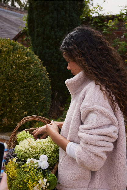 Woman outdoors wearing Gym+Coffee Industry Fleece High Collar Jacket Natural Shop Gym+Coffee at Dotique