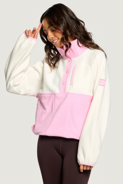 Woman wearing Gym+Coffee Snap Polar Fleece Pink Blossom jumper Shop Gym+Coffee at Dotique