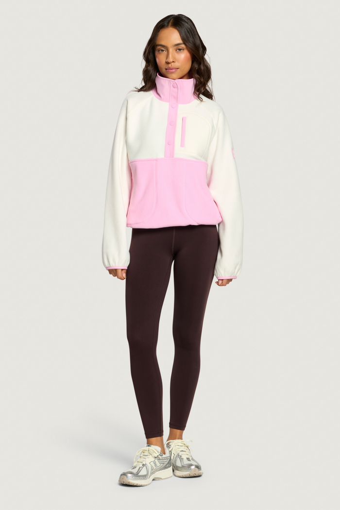 Model wearing Gym+Coffee Snap Polar Fleece Pink Blossom jumper Shop Gym+Coffee at Dotique