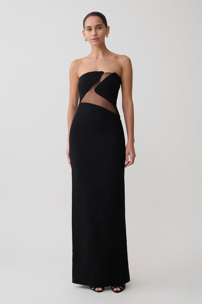 Black strapless gown with cut-out design on a white background